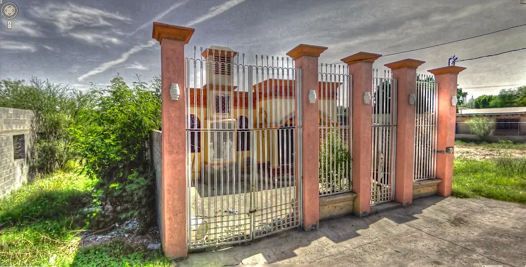 Supreme Security patrol vehicle at the gated entrance of a King City estate at dusk
