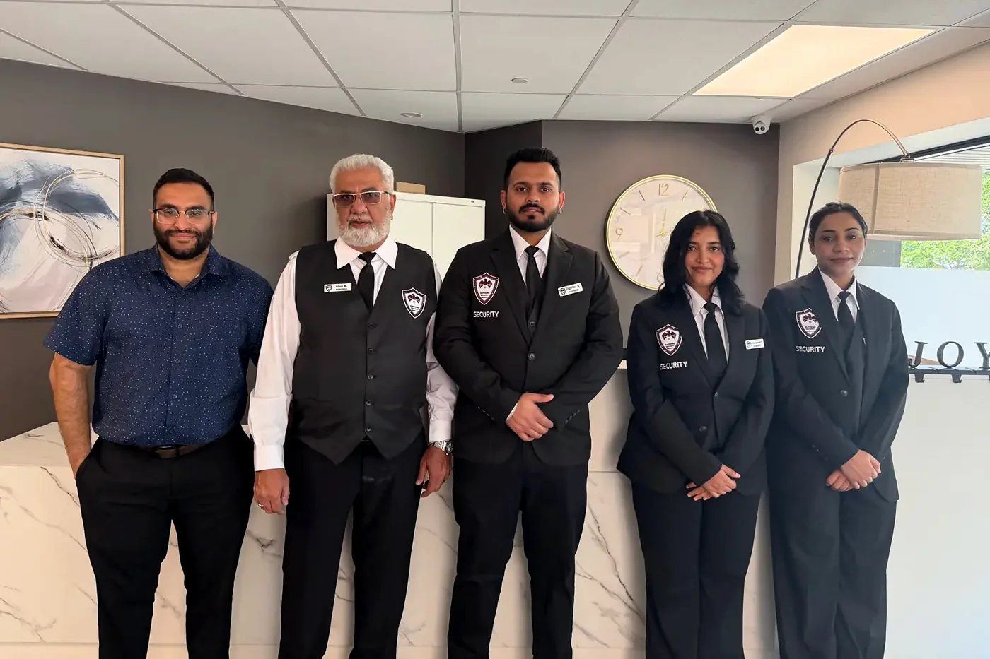 Supreme Security Services management and concierge team at a client building
